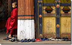 Bhutan_MonkGuardingShoesChristine-Hansen-WP